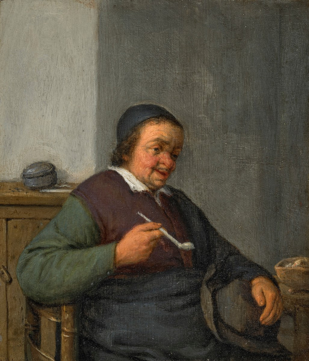 A man holding a pipe in an interior
