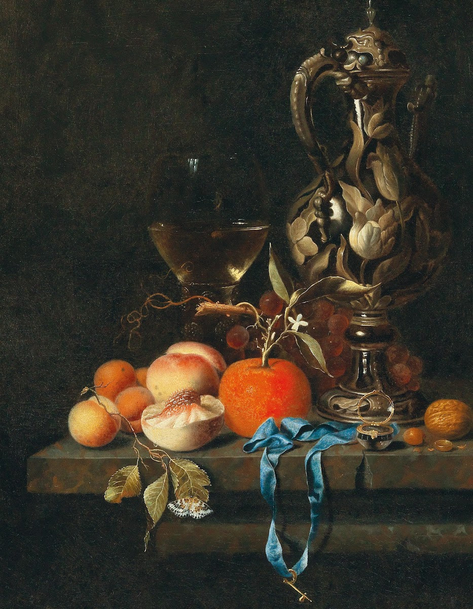 Apricots peaches and other fruit with glass and a jug