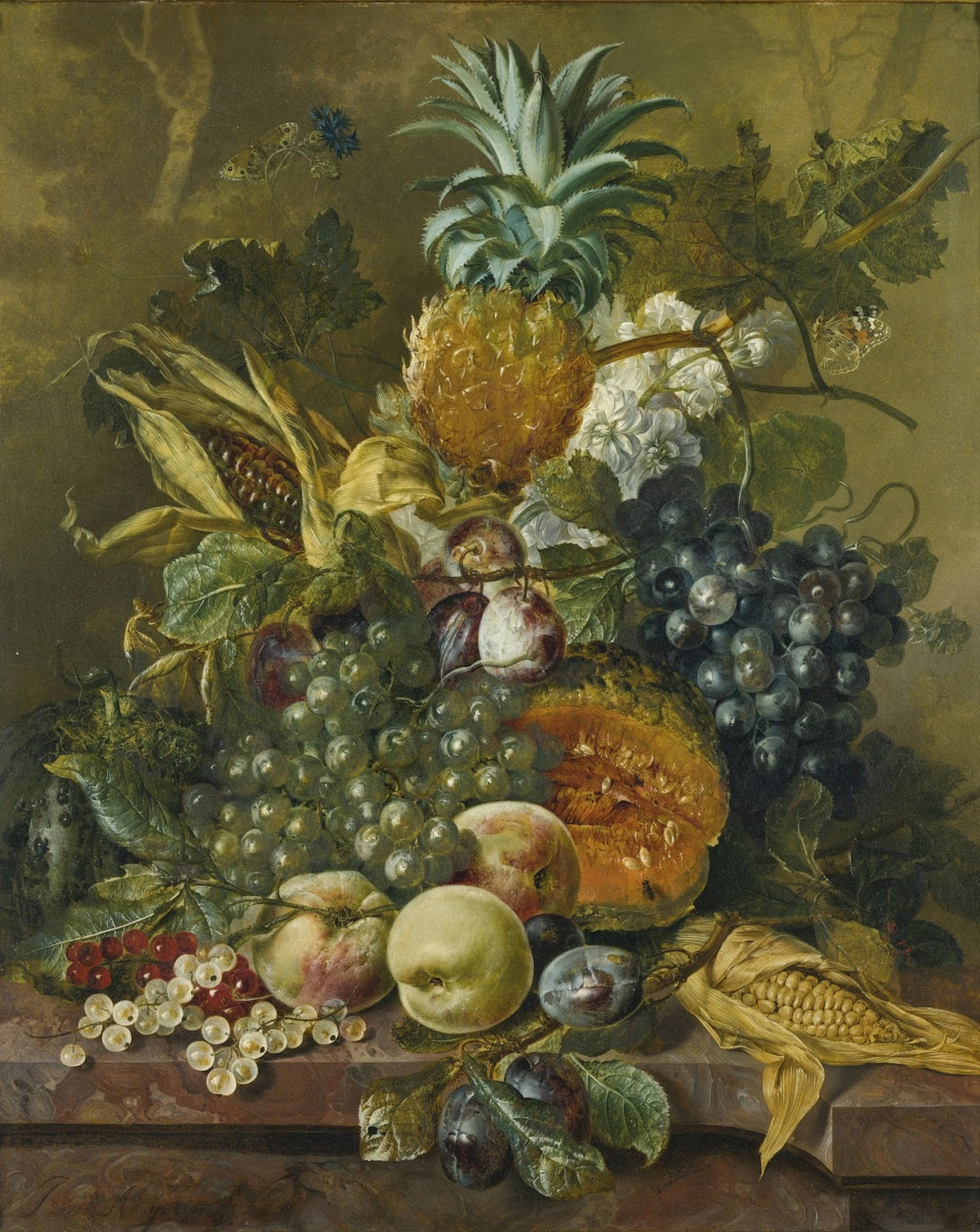 A pineapple plums grapes and other fruit with corn on a marble ledge