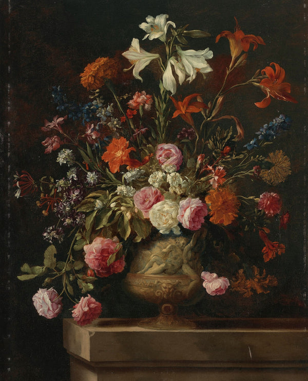 Lilies carnations roses and other flowers in a gilt urn with bas relief on a sto