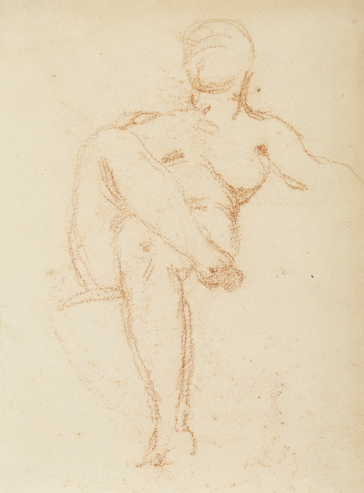 Femme nue assise jambes croisées