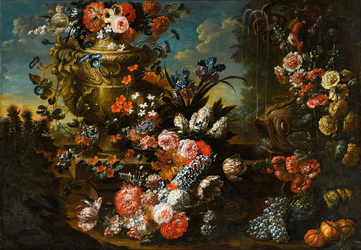 A stone urn on steps decorated with flowers and fruit beside a dolphin headed fo