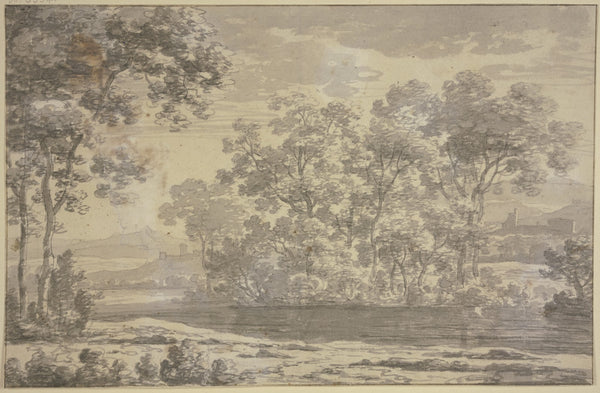 Group of trees near a water with buildings in the middle ground and a mountain r