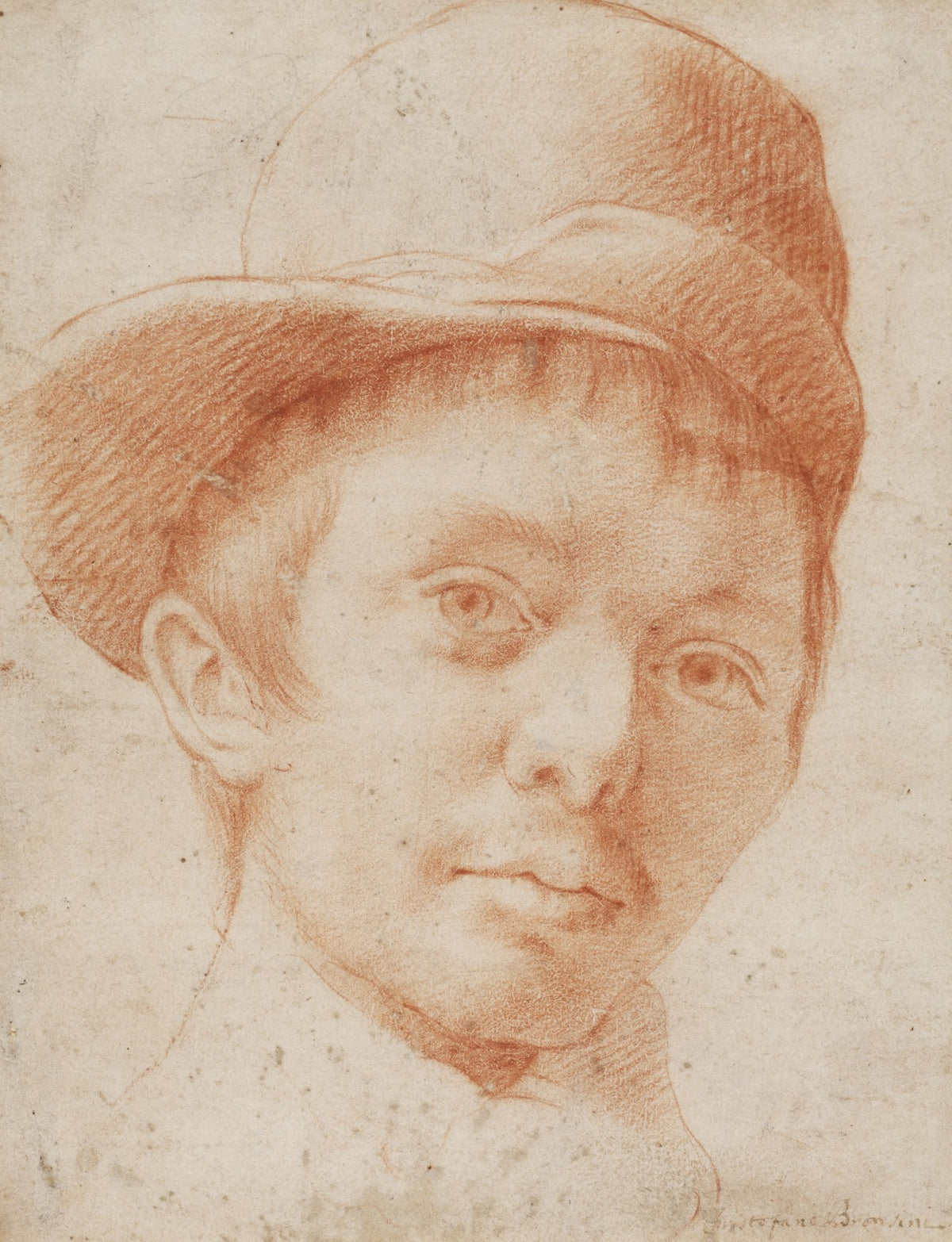 A boy wearing a workmans hat ca 1600