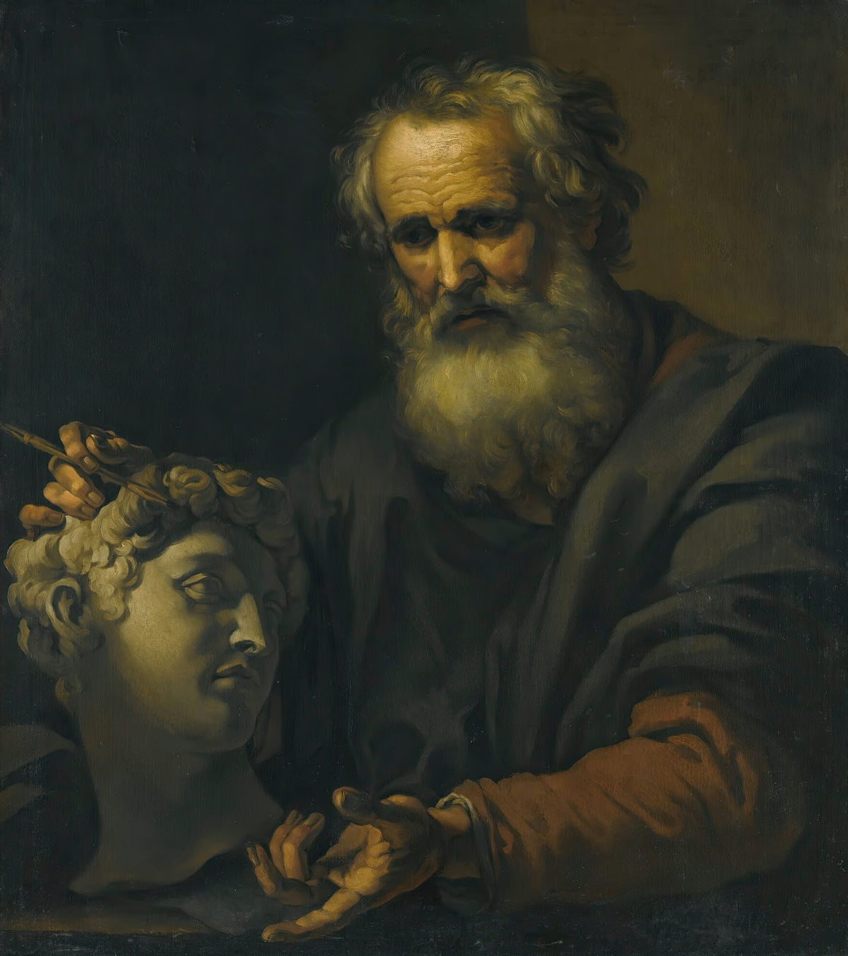 A PhilosopherDeep In Thought Holding A Sculpted Head