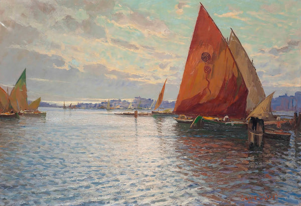 Fishing vessels moored off an Italian town at dusk