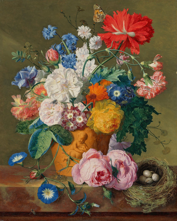 Roses and other flowers in a terracotta vase with a birds nest on a marble ledge