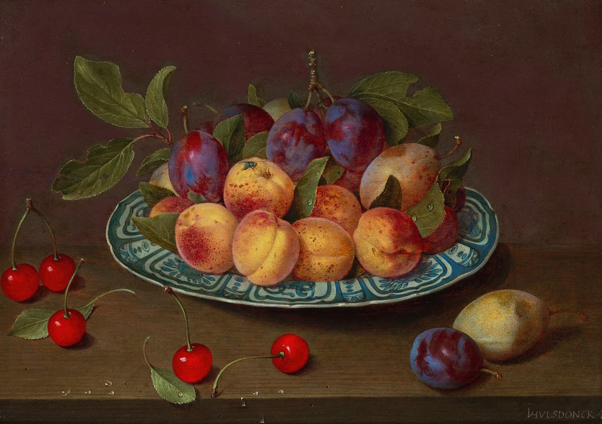 Still life with kraak porcelain dishes cherries plums and apricots on a tabletop
